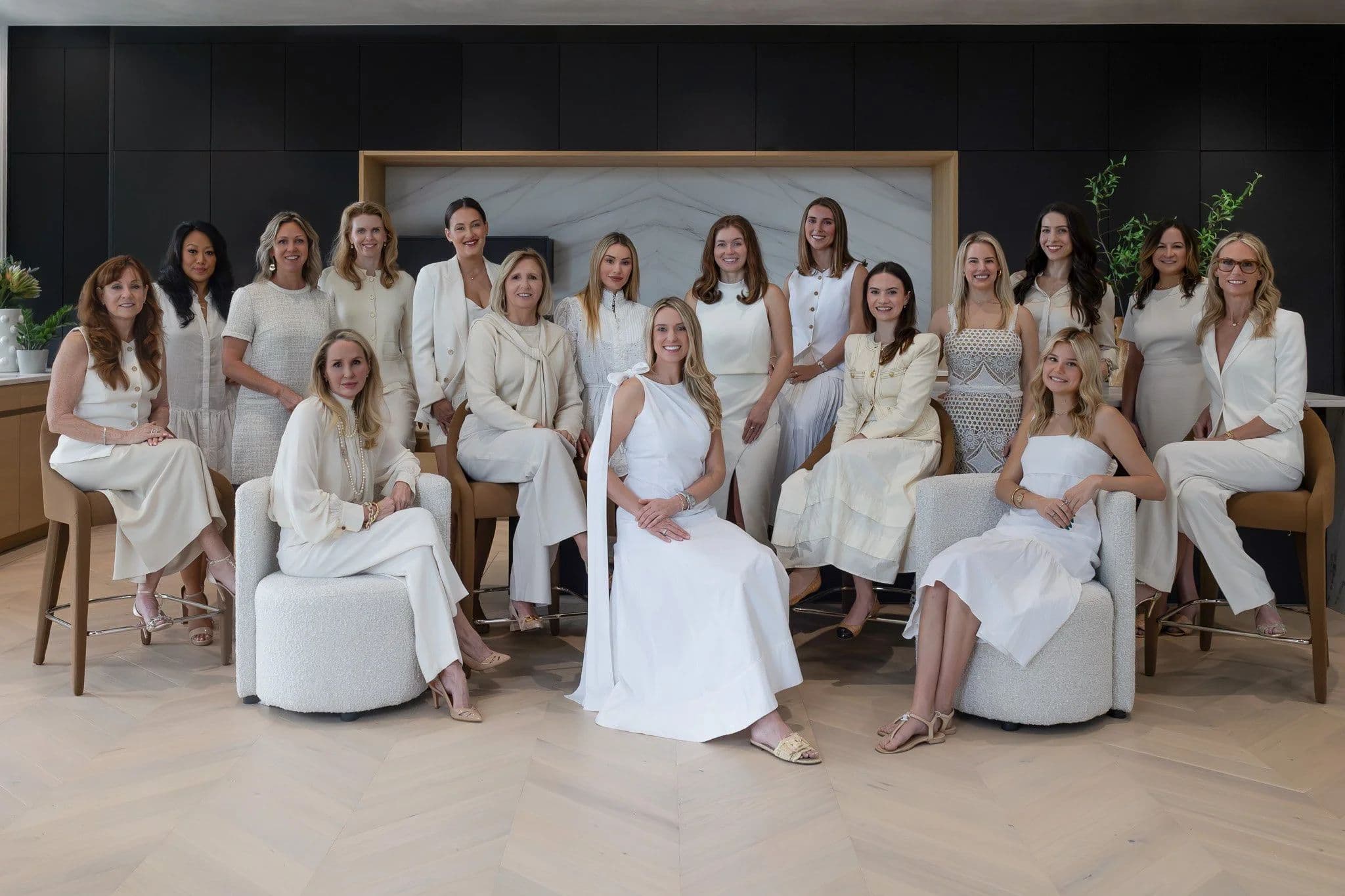 The B. Moore Organized team, dressed in white and cream, in a styled Austin kitchen